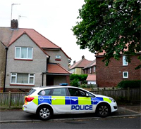 Pic: police car outside dog bite house