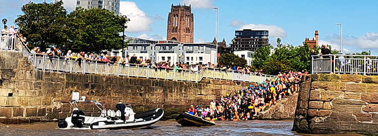 image: Swimmers enetring the water