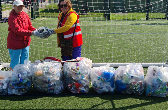 Bev with friends and the bags of rubbish they collected